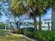 Scenic backyard featuring lush landscaping and serene water views at 1943 Bayou Grande Ne Blvd, St Petersburg, FL 33703