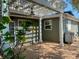Charming outdoor patio featuring a pergola, ceiling fan, and brick paving at 1943 Bayou Grande Ne Blvd, St Petersburg, FL 33703