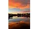 Stunning sunset reflecting on the waterfront, creating a serene and picturesque scene at 1943 Bayou Grande Ne Blvd, St Petersburg, FL 33703