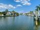 Scenic waterfront view with boats docked along the canal, showcasing a tranquil and picturesque community at 1943 Bayou Grande Ne Blvd, St Petersburg, FL 33703