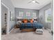 Comfortable bedroom with neutral colors, complemented by pops of blues and wood accents at 26810 Weiskopf Dr, Englewood, FL 34223