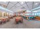 Spacious clubhouse lounge with bar and seating at 3942 Trophy Blvd, New Port Richey, FL 34655