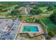 Community lap pool with many swimmers at 3942 Trophy Blvd, New Port Richey, FL 34655