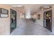 Hallway connecting golf shop and lounge areas at 3942 Trophy Blvd, New Port Richey, FL 34655