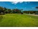 Landscaped driving range with putting green at 3942 Trophy Blvd, New Port Richey, FL 34655