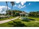 White gazebo on landscaped grounds near pool at 3942 Trophy Blvd, New Port Richey, FL 34655