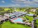 Aerial view of clubhouse and pools at 3942 Trophy Blvd, New Port Richey, FL 34655