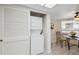 Stackable washer and dryer tucked away in a closet with louvered doors at 3942 Trophy Blvd, New Port Richey, FL 34655