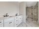 Bathroom features double sinks, quartz counters, and walk in shower at 407 S Albany Ave # 2, Tampa, FL 33606