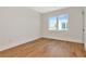 Bedroom features a large window and pristine hard wood floors at 407 S Albany Ave # 2, Tampa, FL 33606