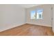 Bedroom features a large window and pristine hard wood floors at 407 S Albany Ave # 2, Tampa, FL 33606