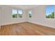 Bedroom features crown molding, multiple windows and wood floors at 407 S Albany Ave # 2, Tampa, FL 33606