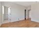 Bedroom features open doors and pristine hard wood floors at 407 S Albany Ave # 2, Tampa, FL 33606