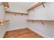 Walk in closet features built-in shelving, wood floors at 407 S Albany Ave # 2, Tampa, FL 33606
