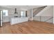 Open concept living space with modern kitchen featuring stainless appliances and staircase at 407 S Albany Ave # 2, Tampa, FL 33606