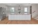 Well-appointed kitchen featuring white cabinets and a large center island at 407 S Albany Ave # 2, Tampa, FL 33606