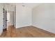 Neutral bedroom featuring hardwood floors, white trim and paint and two closets at 407 S Albany Ave # 6, Tampa, FL 33606