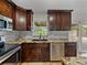 Kitchen with granite countertops, stainless steel appliances, and view to backyard at 5605 103Rd N Ter, Pinellas Park, FL 33782