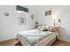 Guest bedroom with a full-size bed, dresser, and decorative wall art at 5195 Highbury Cir, Sarasota, FL 34238