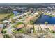 Property is situated on a large lot with water views and mature landscaping at 5195 Highbury Cir, Sarasota, FL 34238