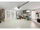Spacious garage with ample storage, workbench, and room for multiple vehicles at 5195 Highbury Cir, Sarasota, FL 34238