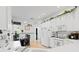 White kitchen with ample counter space, stainless steel appliances, and breakfast nook at 5195 Highbury Cir, Sarasota, FL 34238