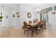 Charming dining room with a wood table, six chairs, and decorative accents at 5195 Highbury Cir, Sarasota, FL 34238