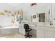 Double vanity bathroom with a large soaking tub, walk-in shower, and ample counter space at 5195 Highbury Cir, Sarasota, FL 34238