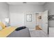 Bedroom with a queen bed, and access to a hallway at 26810 Weiskopf Dr, Englewood, FL 34223