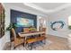 Bright dining room features a wooden table and stylish decor at 26810 Weiskopf Dr, Englewood, FL 34223