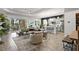 Open concept living area with a view of the kitchen and patio at 26810 Weiskopf Dr, Englewood, FL 34223