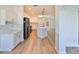 Bright kitchen featuring white cabinets, quartz countertops, and stainless steel appliances at 1148 Emerald Hill Way, Valrico, FL 33594