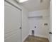 Laundry room with shelving and built in cabinets at 1148 Emerald Hill Way, Valrico, FL 33594