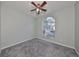 Spacious bedroom with arched window and ceiling fan at 1148 Emerald Hill Way, Valrico, FL 33594