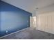 Bedroom with blue accent wall and large closet at 1148 Emerald Hill Way, Valrico, FL 33594