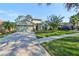 House exterior with driveway, landscaping, and two-car garage at 1148 Emerald Hill Way, Valrico, FL 33594