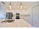 Modern kitchen island with quartz countertop and double sink at 1148 Emerald Hill Way, Valrico, FL 33594