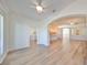 Bright living room with hardwood floors and views into kitchen and backyard at 1148 Emerald Hill Way, Valrico, FL 33594