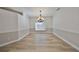 Spacious dining room with hardwood floors and a chandelier at 1148 Emerald Hill Way, Valrico, FL 33594
