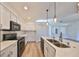 Modern kitchen with stainless steel appliances and white cabinetry at 1148 Emerald Hill Way, Valrico, FL 33594