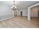 Dining room with hardwood floors, chandelier, and views to other rooms at 1148 Emerald Hill Way, Valrico, FL 33594