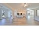 Open concept living area with hardwood floors and kitchen views at 1148 Emerald Hill Way, Valrico, FL 33594