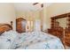 Spacious bedroom with wooden furniture and a starfish bedding set at 6419 43Rd E Ct, Sarasota, FL 34243