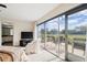 Main bedroom with access to private bathroom and sliding glass doors to patio at 3942 Trophy Blvd, New Port Richey, FL 34655
