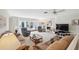 Spacious living room featuring a fireplace and ample seating at 3942 Trophy Blvd, New Port Richey, FL 34655