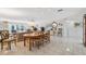 Open concept dining area with adjoining living room at 3942 Trophy Blvd, New Port Richey, FL 34655