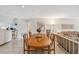 Bright dining room with wood table and seating for four at 3942 Trophy Blvd, New Port Richey, FL 34655