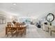 Open concept dining area with adjoining living room at 3942 Trophy Blvd, New Port Richey, FL 34655