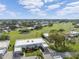 Wide aerial view of the property and golf course community at 3942 Trophy Blvd, New Port Richey, FL 34655