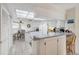Efficient kitchen with white cabinets and breakfast nook at 3942 Trophy Blvd, New Port Richey, FL 34655